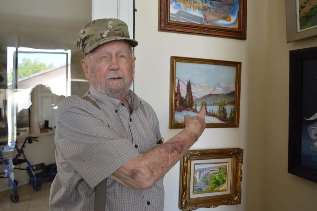 Jim Lambell, showing off the first painting he ever made!